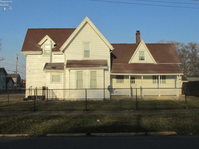 604 E Jefferson St, Sandusky, OH 44870 - view of front of house with a chimney