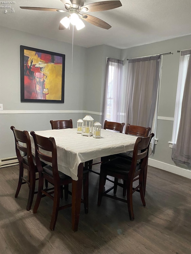 604 E Jefferson St, Sandusky, OH 44870 - dining space with dark wood-style flooring, ceiling fan, and baseboards