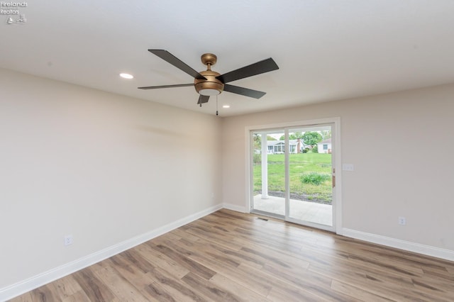 412 E 10th St, Port Clinton, OH 43452 - unfurnished room with baseboards, light wood finished floors, a ceiling fan, and recessed lighting