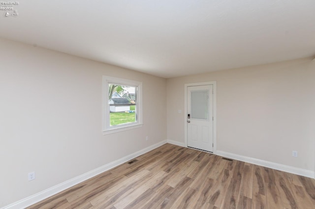 412 E 10th St, Port Clinton, OH 43452 - unfurnished room featuring light wood-style flooring and baseboards