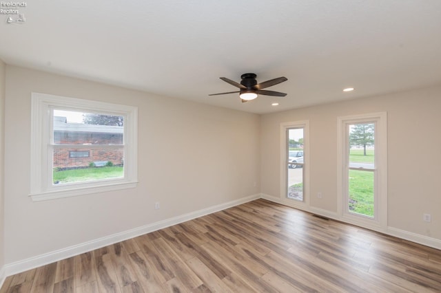 412 E 10th St, Port Clinton, OH 43452 - unfurnished room featuring light wood finished floors, ceiling fan, baseboards, and recessed lighting