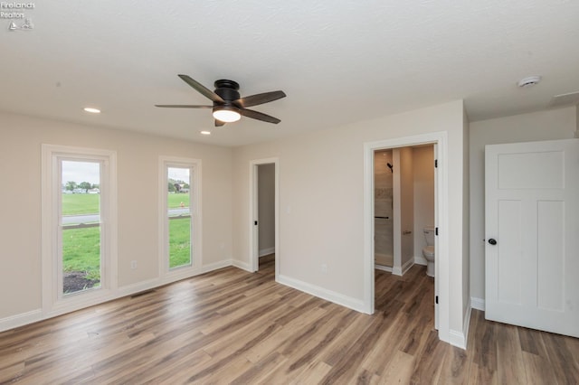 412 E 10th St, Port Clinton, OH 43452 - spare room featuring a ceiling fan, light wood-style flooring, baseboards, recessed lighting, and a smoke detector