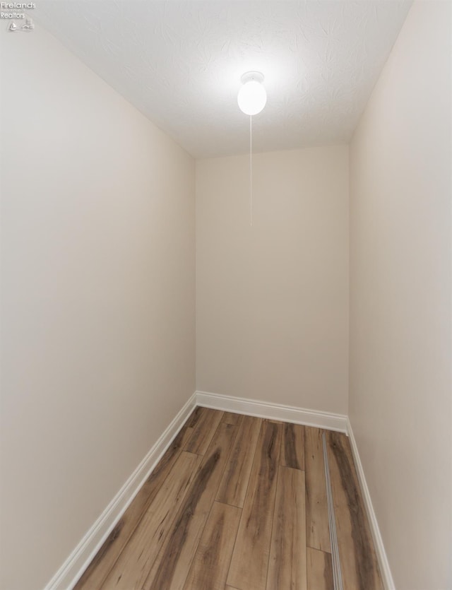 412 E 10th St, Port Clinton, OH 43452 - spare room featuring wood finished floors and baseboards