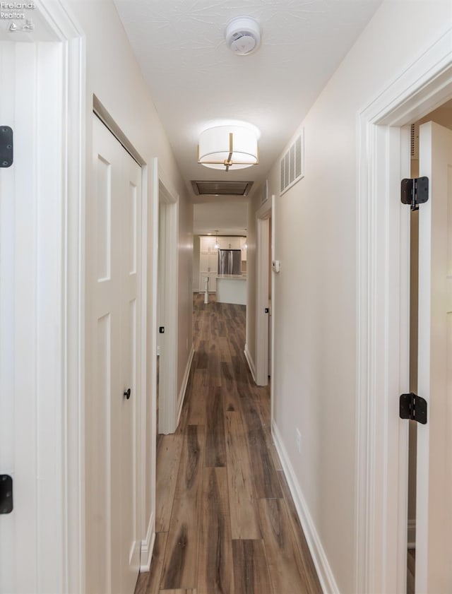 412 E 10th St, Port Clinton, OH 43452 - corridor with dark wood finished floors and baseboards