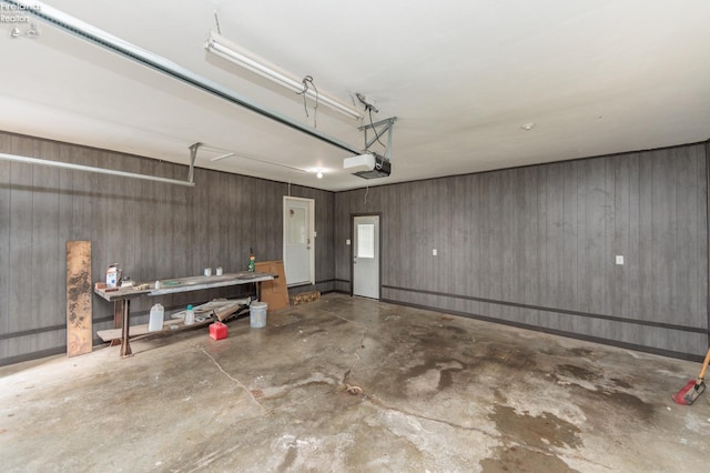 412 E 10th St, Port Clinton, OH 43452 - garage featuring a garage door opener and wood walls