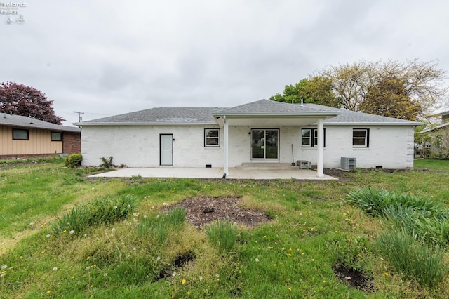 412 E 10th St, Port Clinton, OH 43452 - rear view of house featuring a patio area, central air condition unit, a yard, and a shingled roof