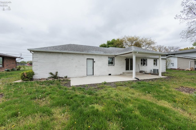412 E 10th St, Port Clinton, OH 43452 - back of property featuring a patio area, a yard, cooling unit, and brick siding