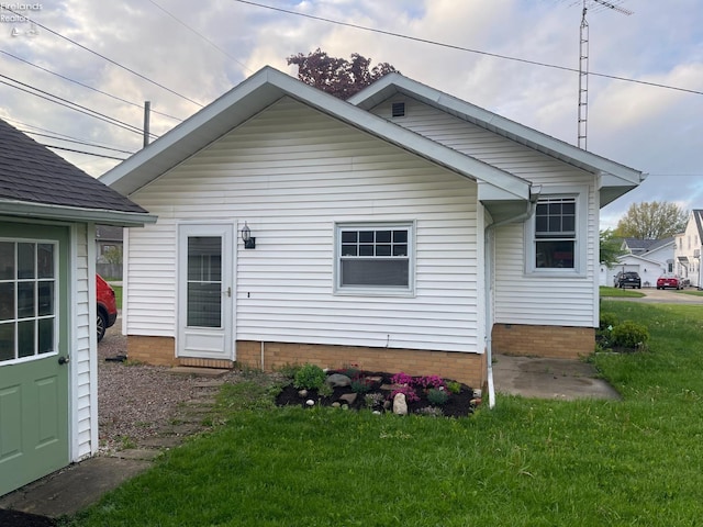 back of house with a yard