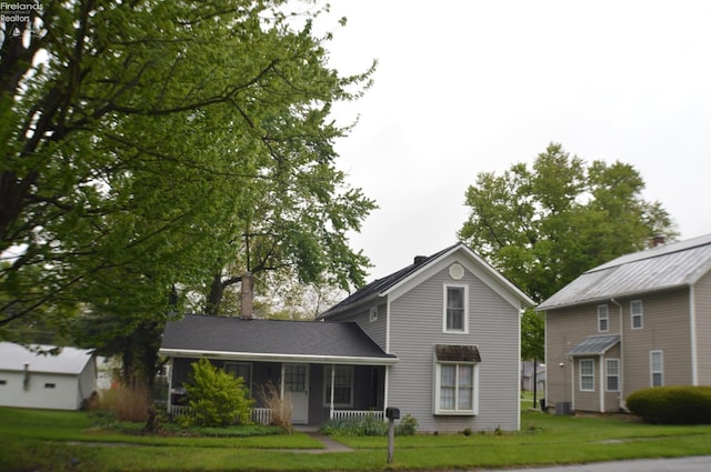 113 W Tiffin St, Attica, OH 44807 - rear view of house featuring a lawn