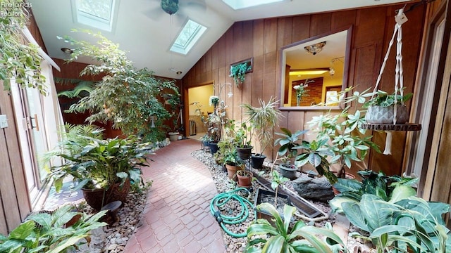 66 Hillcrest Dr, Willard, OH 44890 - reception featuring wooden walls, a skylight, and vaulted ceiling