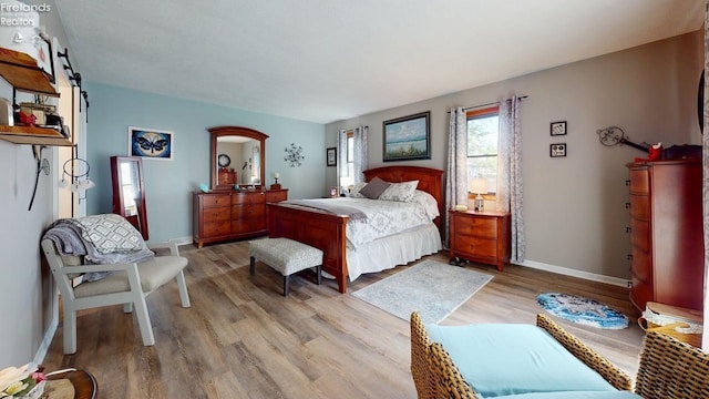 66 Hillcrest Dr, Willard, OH 44890 - bedroom with light wood-style floors and baseboards