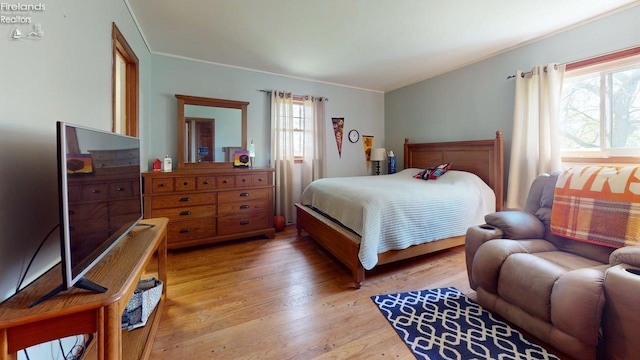66 Hillcrest Dr, Willard, OH 44890 - bedroom with crown molding and light wood-type flooring