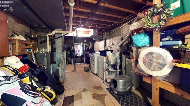66 Hillcrest Dr, Willard, OH 44890 - unfinished below grade area featuring washer and clothes dryer and heating unit