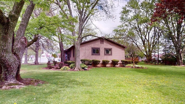 66 Hillcrest Dr, Willard, OH 44890 - view of side of property featuring a lawn