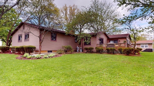 66 Hillcrest Dr, Willard, OH 44890 - view of front of house featuring a wooden deck and a front lawn