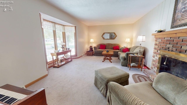 66 Hillcrest Dr, Willard, OH 44890 - carpeted living room with a fireplace and baseboards