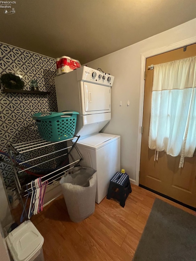 81 Melissa St, Tiffin, OH 44883 - clothes washing area with stacked washer / dryer and light wood finished floors