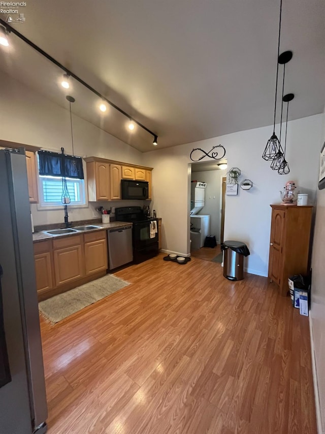 81 Melissa St, Tiffin, OH 44883 - kitchen featuring black appliances, a sink, vaulted ceiling, track lighting, and light wood-style flooring