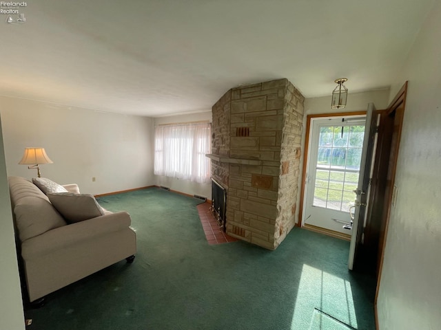 5 Old State Rd, Norwalk, OH 44857 - living area featuring carpet floors, plenty of natural light, a fireplace, and baseboards