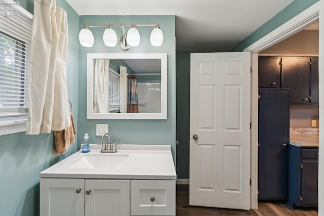 515 Berlin Rd, Huron, OH 44839 - full bath with vanity, wood finished floors, and a shower with curtain