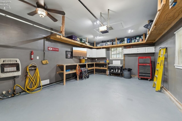 515 Berlin Rd, Huron, OH 44839 - garage featuring heating unit, ceiling fan, a garage door opener, and a workshop area
