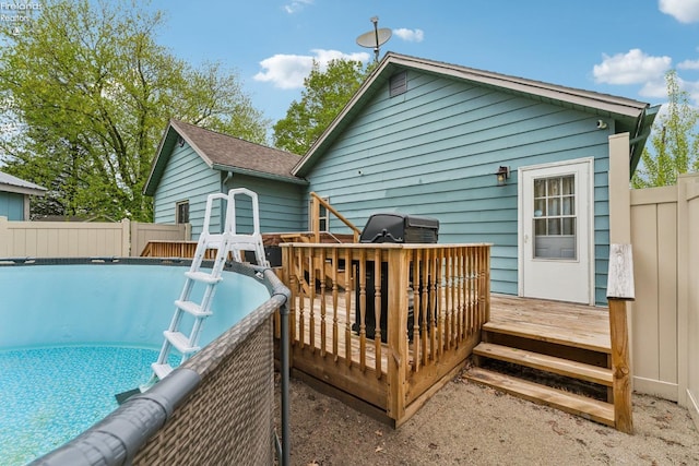 515 Berlin Rd, Huron, OH 44839 - rear view of house featuring a wooden deck and fence