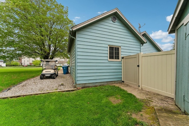 515 Berlin Rd, Huron, OH 44839 - view of home's exterior featuring a yard and a gate