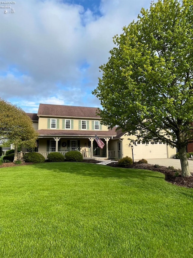 378 Lelar St, Tiffin, OH 44883 - view of front of property with covered porch, a front lawn, and concrete driveway