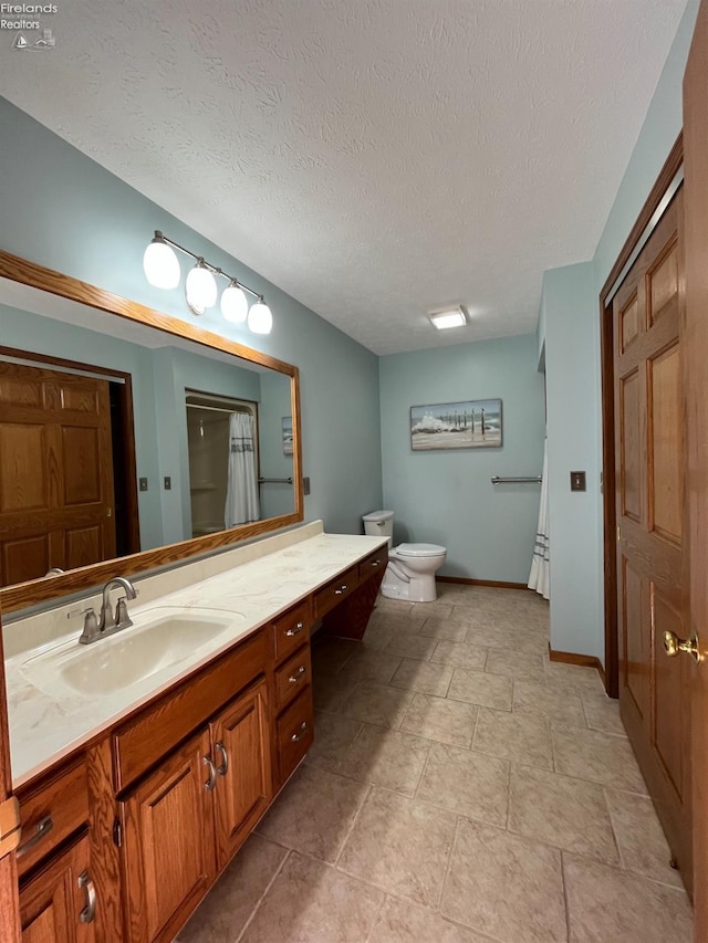378 Lelar St, Tiffin, OH 44883 - bathroom featuring toilet, vanity, a textured ceiling, a shower with curtain, and baseboards