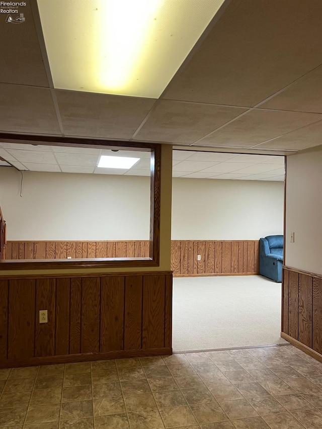 378 Lelar St, Tiffin, OH 44883 - finished basement featuring a drop ceiling, wooden walls, a wainscoted wall, and carpet