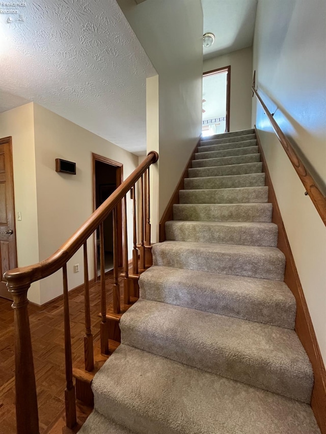 378 Lelar St, Tiffin, OH 44883 - stairway featuring baseboards and a textured ceiling
