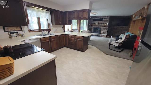 903 N Warpole, Upper Sandusky, OH 43351 - kitchen with a sink, light flooring, a ceiling fan, a brick fireplace, and open floor plan