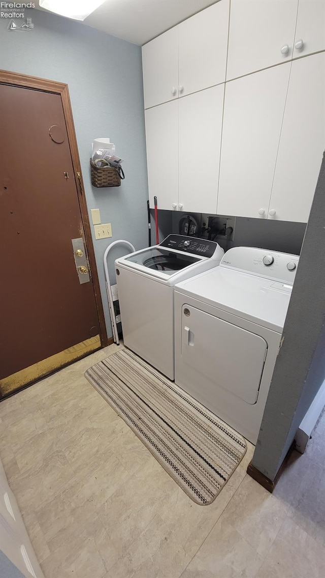 903 N Warpole, Upper Sandusky, OH 43351 - laundry area featuring cabinet space and washing machine and clothes dryer
