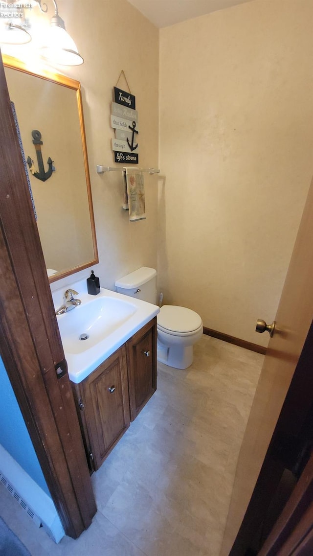903 N Warpole, Upper Sandusky, OH 43351 - bathroom with toilet, vanity, tile patterned floors, and baseboards