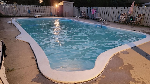 903 N Warpole, Upper Sandusky, OH 43351 - view of swimming pool with fence and a diving board
