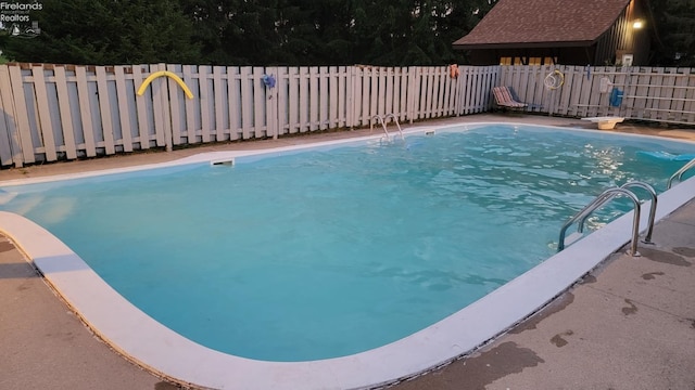 903 N Warpole, Upper Sandusky, OH 43351 - view of swimming pool featuring a fenced backyard and a diving board