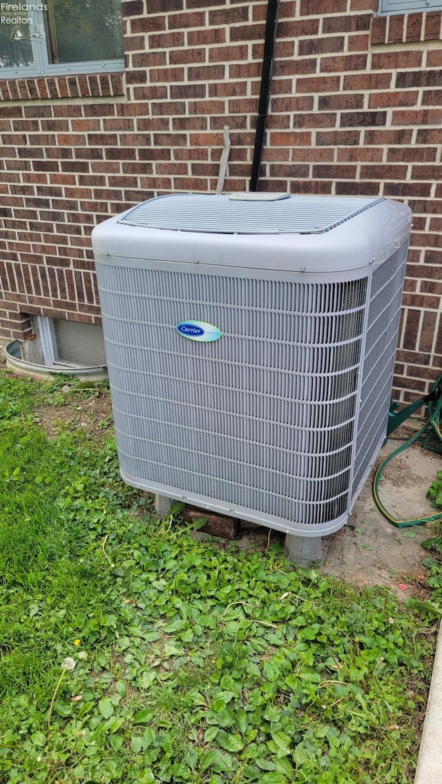 903 N Warpole, Upper Sandusky, OH 43351 - exterior view of central AC unit and brick siding