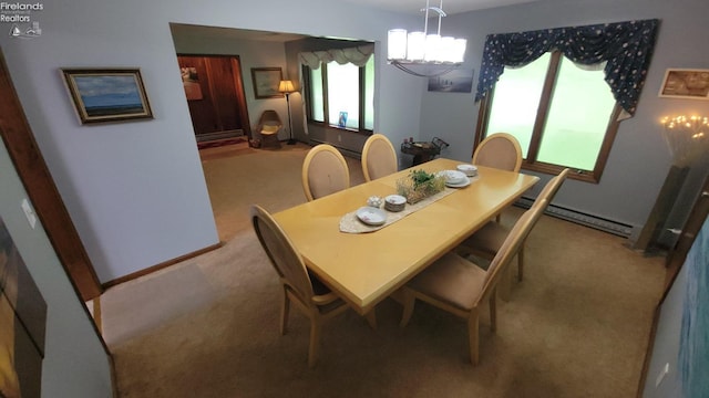 903 N Warpole, Upper Sandusky, OH 43351 - dining space with carpet flooring, baseboard heating, and a chandelier