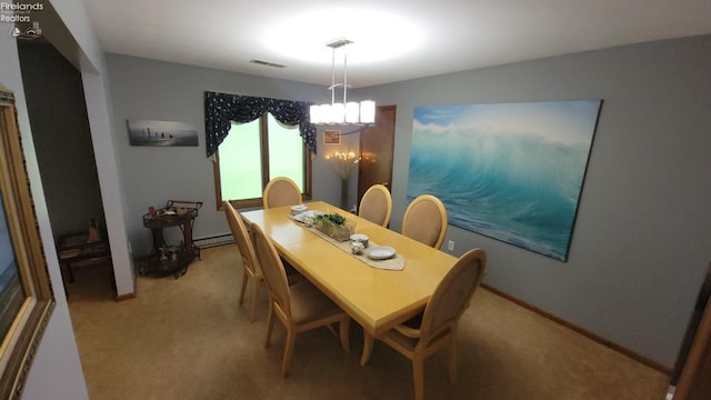 903 N Warpole, Upper Sandusky, OH 43351 - dining space with light carpet, a chandelier, baseboard heating, and baseboards