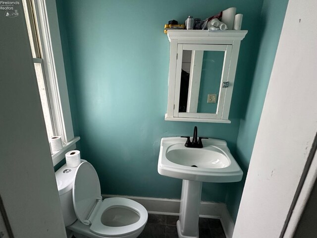 515 W Osborne St, Sandusky, OH 44870 - bathroom with tile patterned floors, baseboards, and toilet