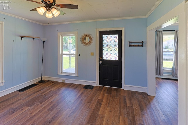 foyer featuring ornamental molding, wood finished floors, baseboards, and ceiling fan