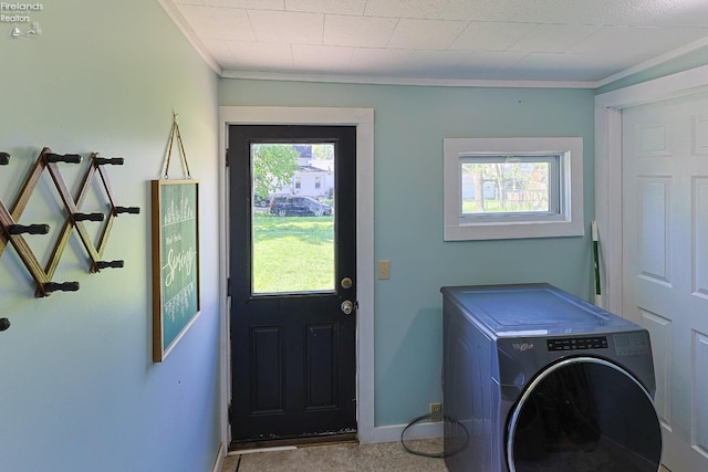 laundry area with washer / clothes dryer, crown molding, and baseboards