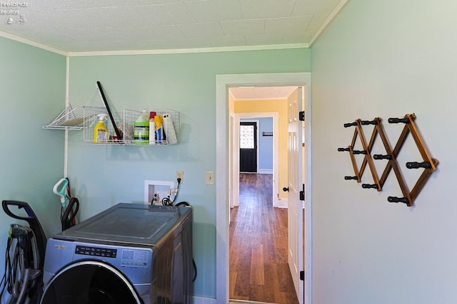 washroom featuring washer / clothes dryer, ornamental molding, and wood finished floors