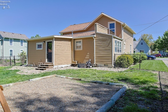 rear view of house with entry steps