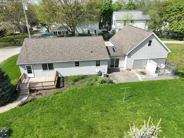 715 Cherry Ave, Lakeside, OH 43440 - back of house featuring a patio, a deck, a yard, and a shingled roof