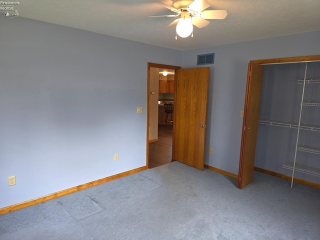 715 Cherry Ave, Lakeside, OH 43440 - unfurnished bedroom featuring a closet, carpet flooring, baseboards, and a ceiling fan