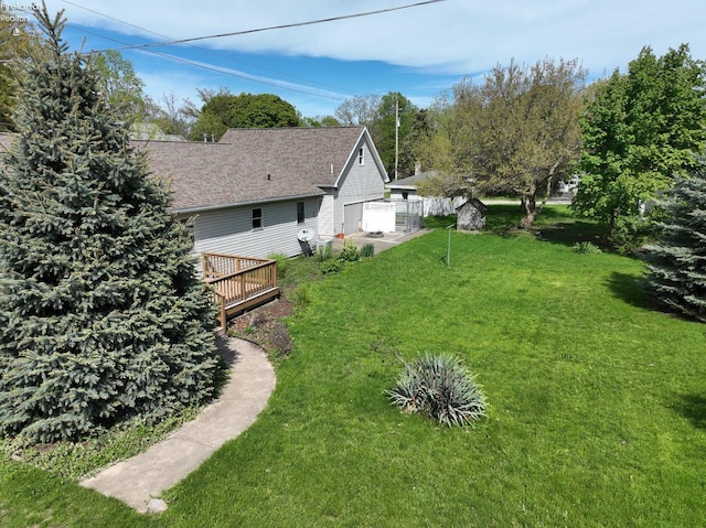 715 Cherry Ave, Lakeside, OH 43440 - view of green lawn with a deck