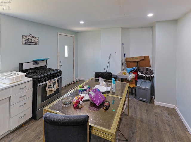 108 Spring St, Willard, OH 44890 - kitchen with stainless steel range with gas cooktop, dark wood-style flooring, white cabinetry, and recessed lighting
