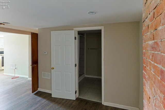 108 Spring St, Willard, OH 44890 - unfurnished bedroom featuring wood finished floors and a spacious closet