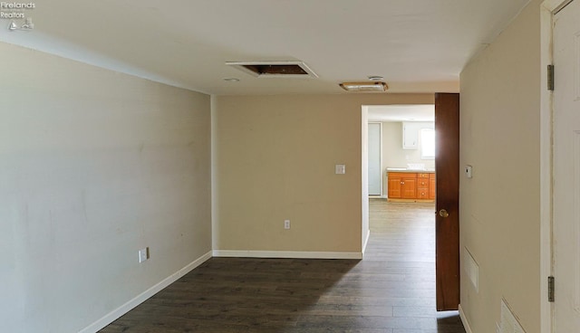 108 Spring St, Willard, OH 44890 - empty room with dark wood-style flooring and baseboards